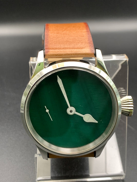42mm Dark green mother of pearl. Swiss movement.