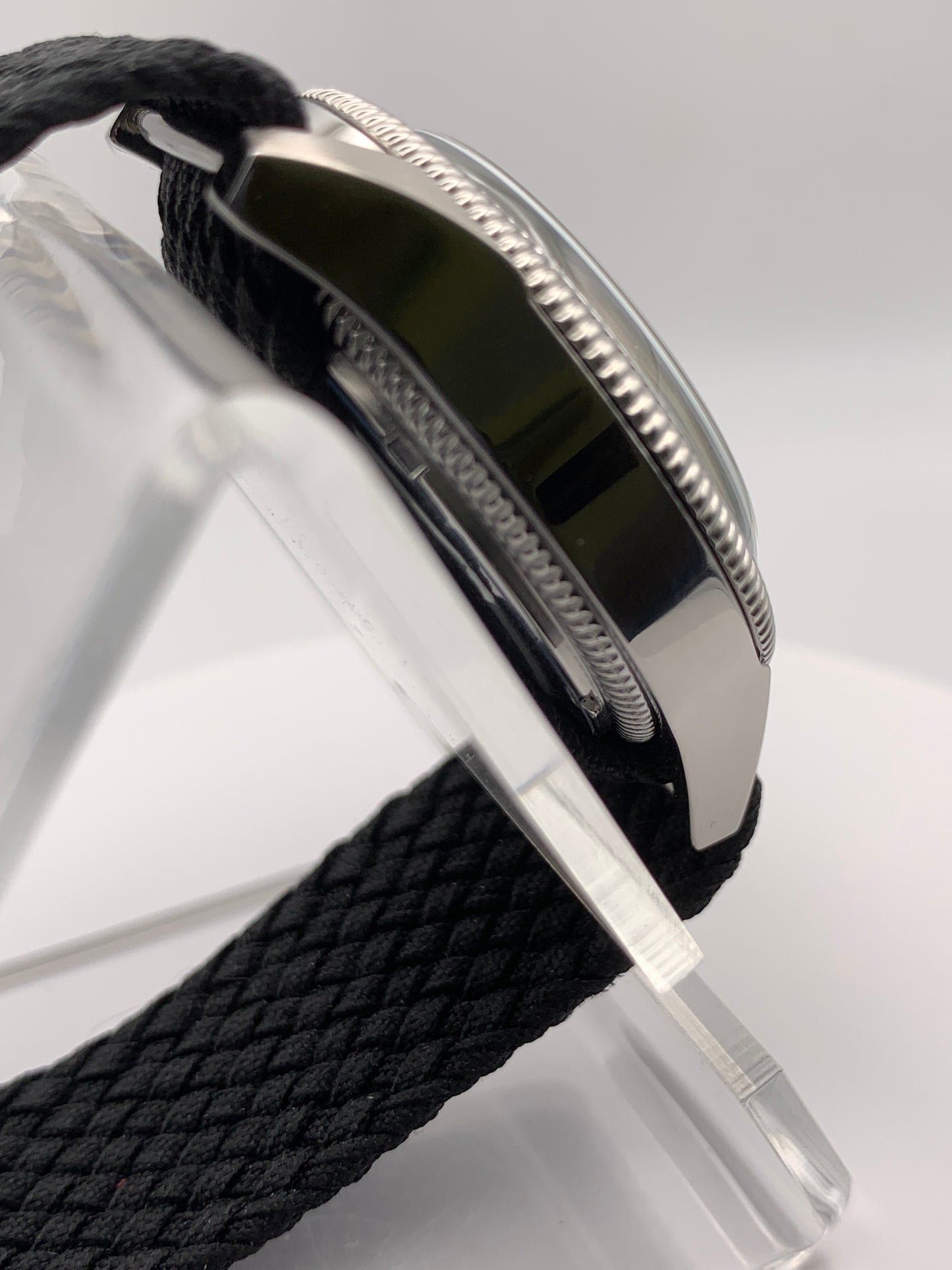 Homesick. 39mm Coin edged stainless steel case. Tobacco sunburst figured dial. AR coated domed mineral glass crystal. Seiko NH35 automatic movement.