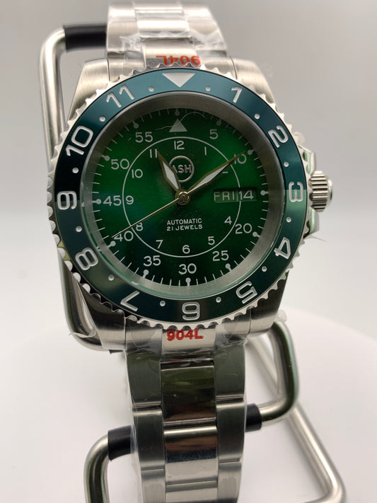 Dead Reckoning - 41mm Stainless Steel case with matching bracelet. Sapphire crystal. Seiko NH36 with green day/date wheels.