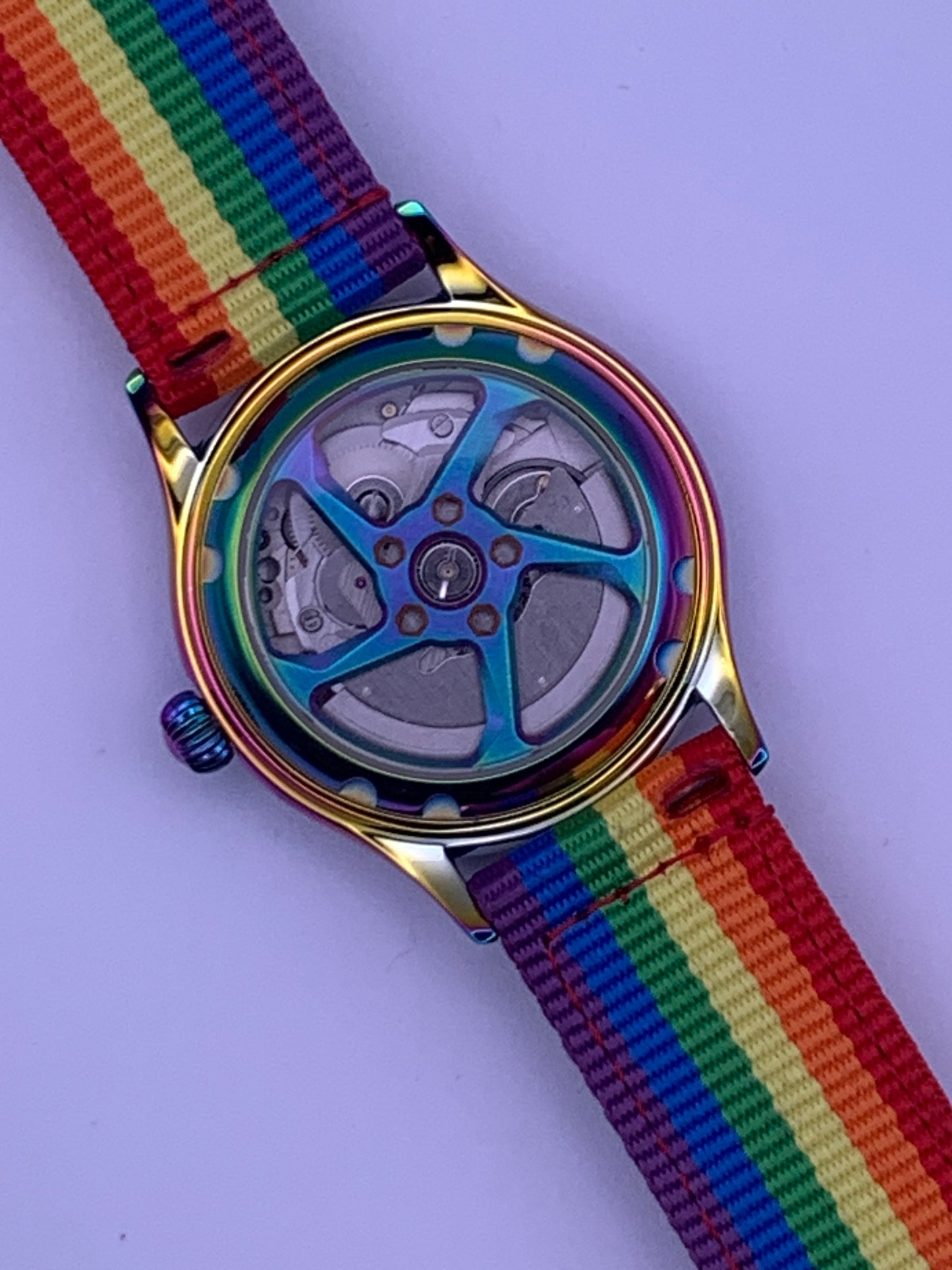 Portable rainbow. 38mm thermally colored stainless steel case and case back. Double dome K-1 mineral crystal. Seiko NH35.