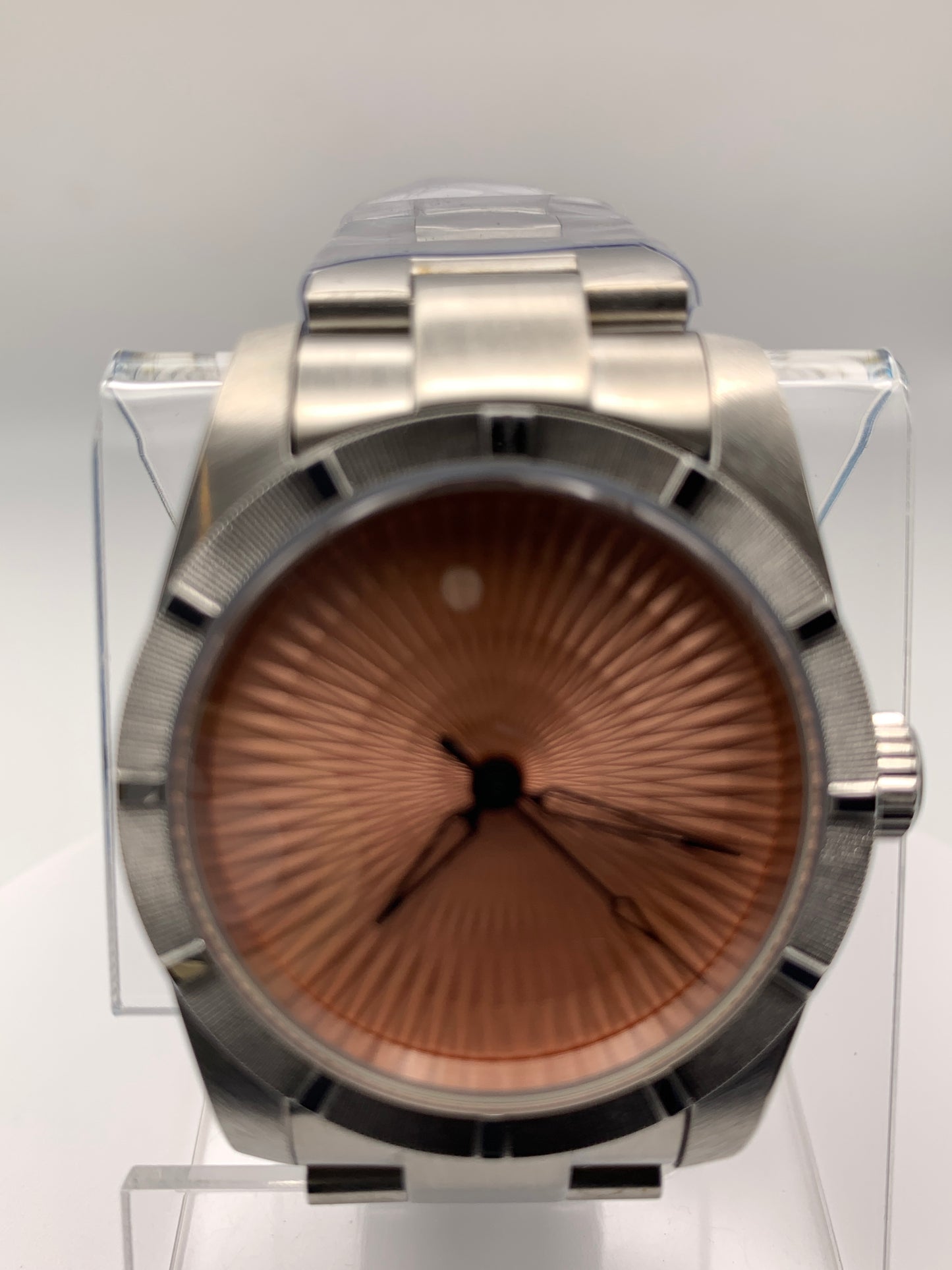 Sunbeam. 39mm stainless steel case and matching bracelet. Textured dial and unique handset. Sapphire crystal. NH38 automatic movement.