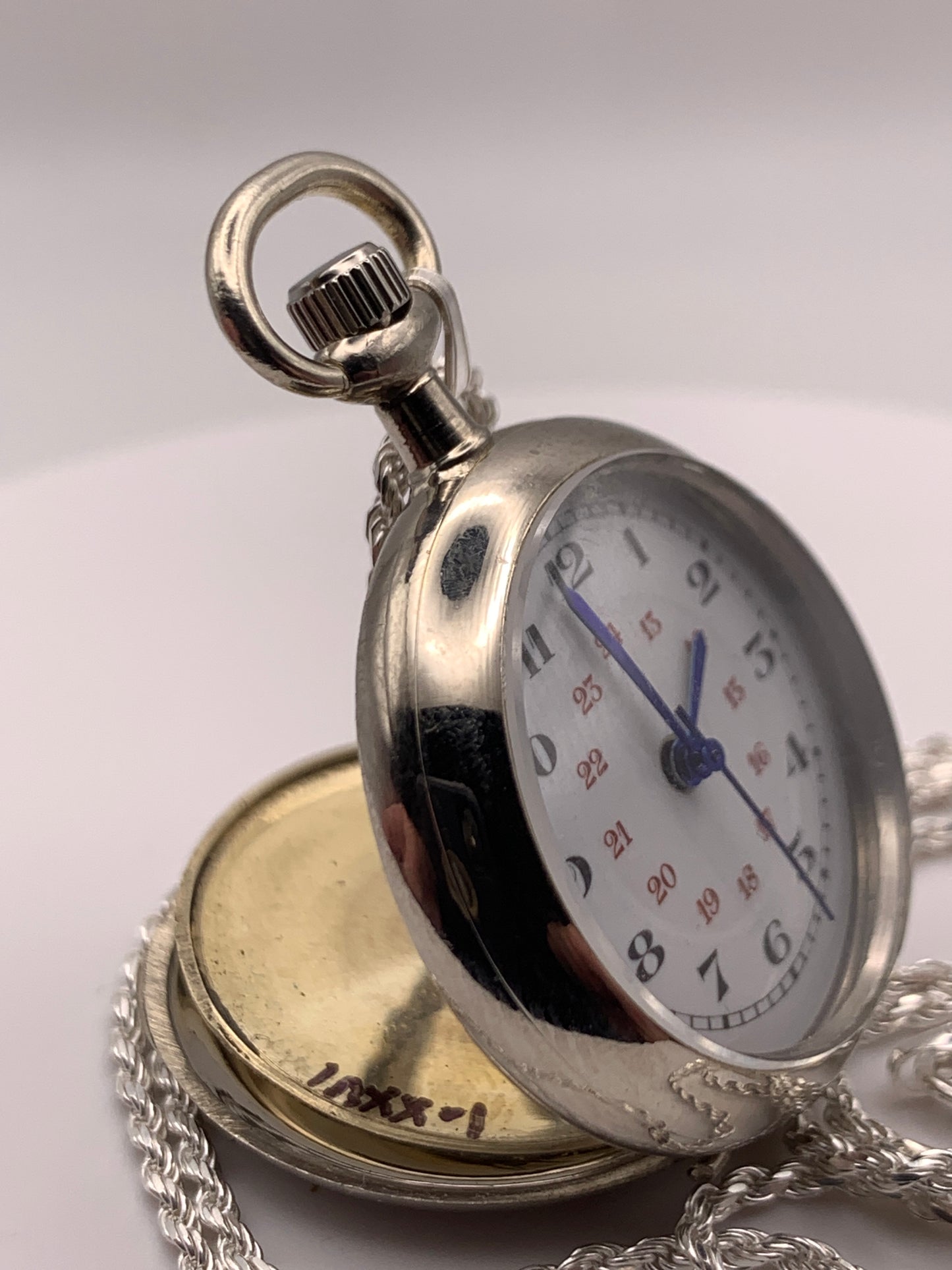 Amuse-bouche Deux. 30mm NOS Argentan alloy pocket / necklace watch. On a 24” 1.5mm sterling silver chain. Sapphire crystal. Vintage hand painted enamel dial. Miyota 2036.