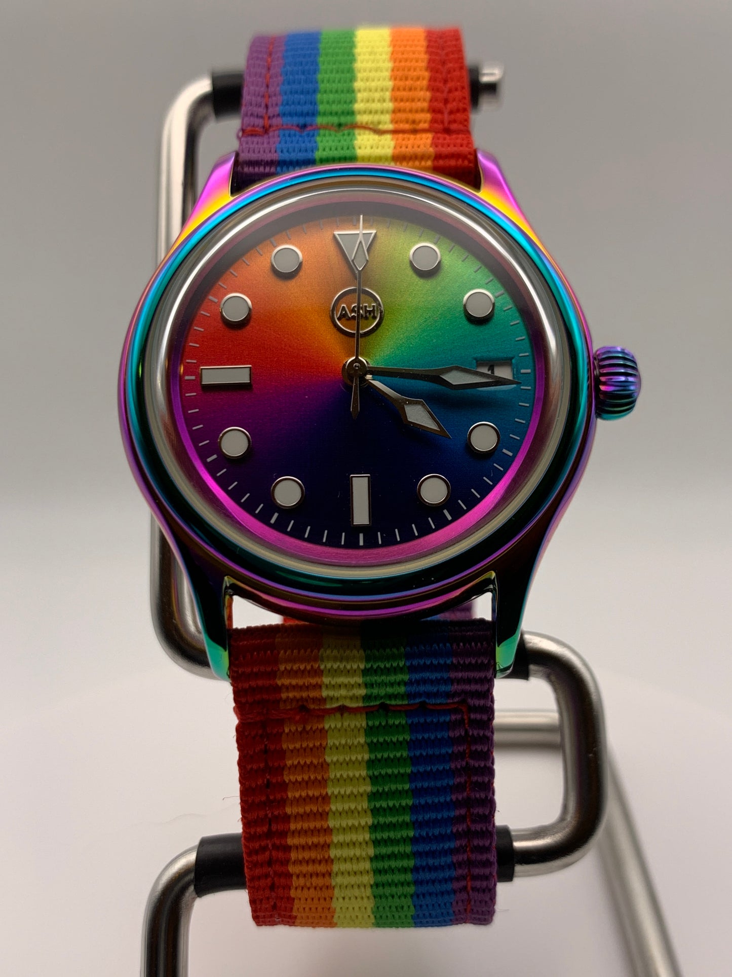 Portable rainbow. 38mm thermally colored stainless steel case and case back. Double dome K-1 mineral crystal. Seiko NH35.