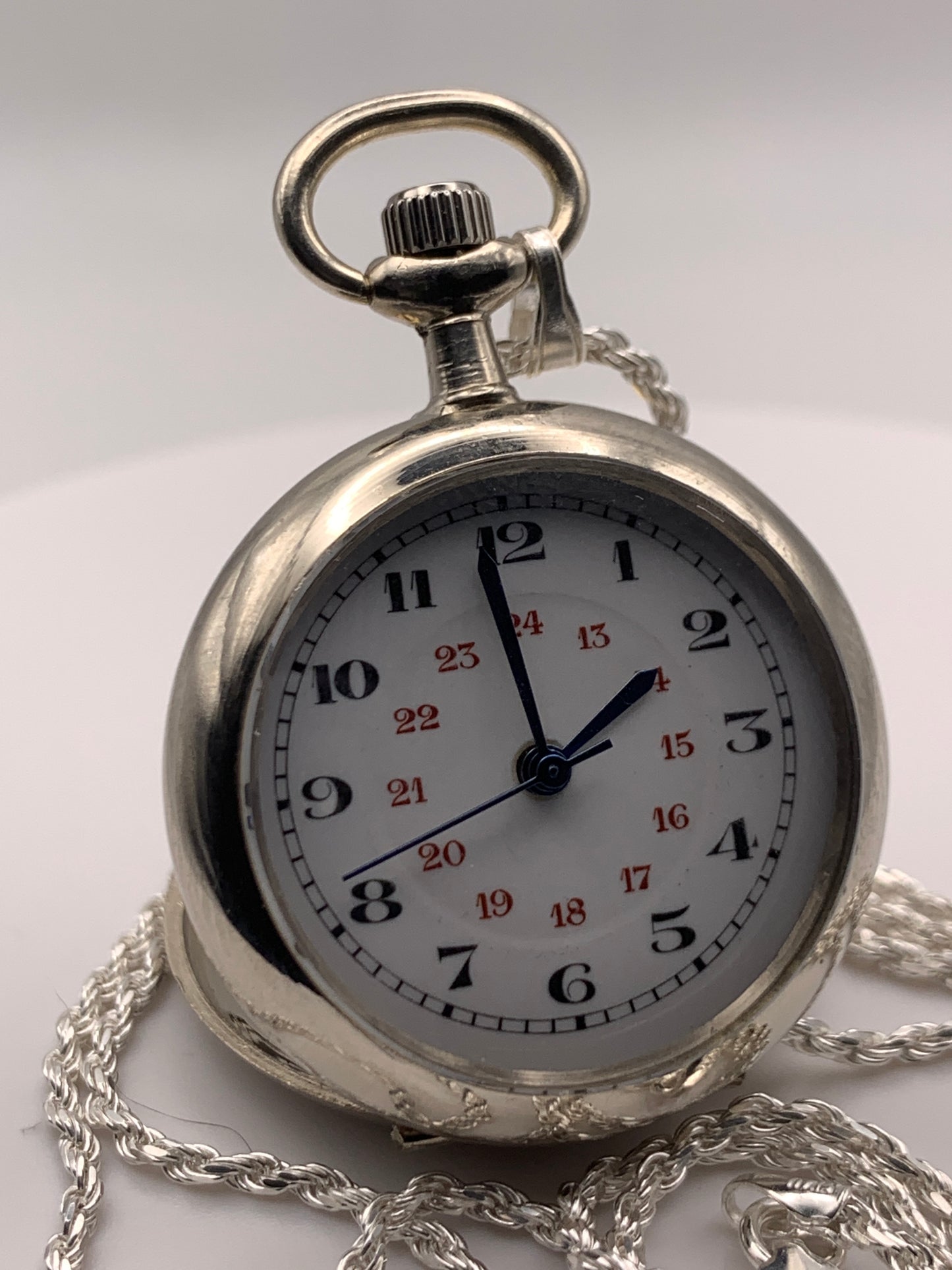 Amuse-bouche Deux. 30mm NOS Argentan alloy pocket / necklace watch. On a 24” 1.5mm sterling silver chain. Sapphire crystal. Vintage hand painted enamel dial. Miyota 2036.
