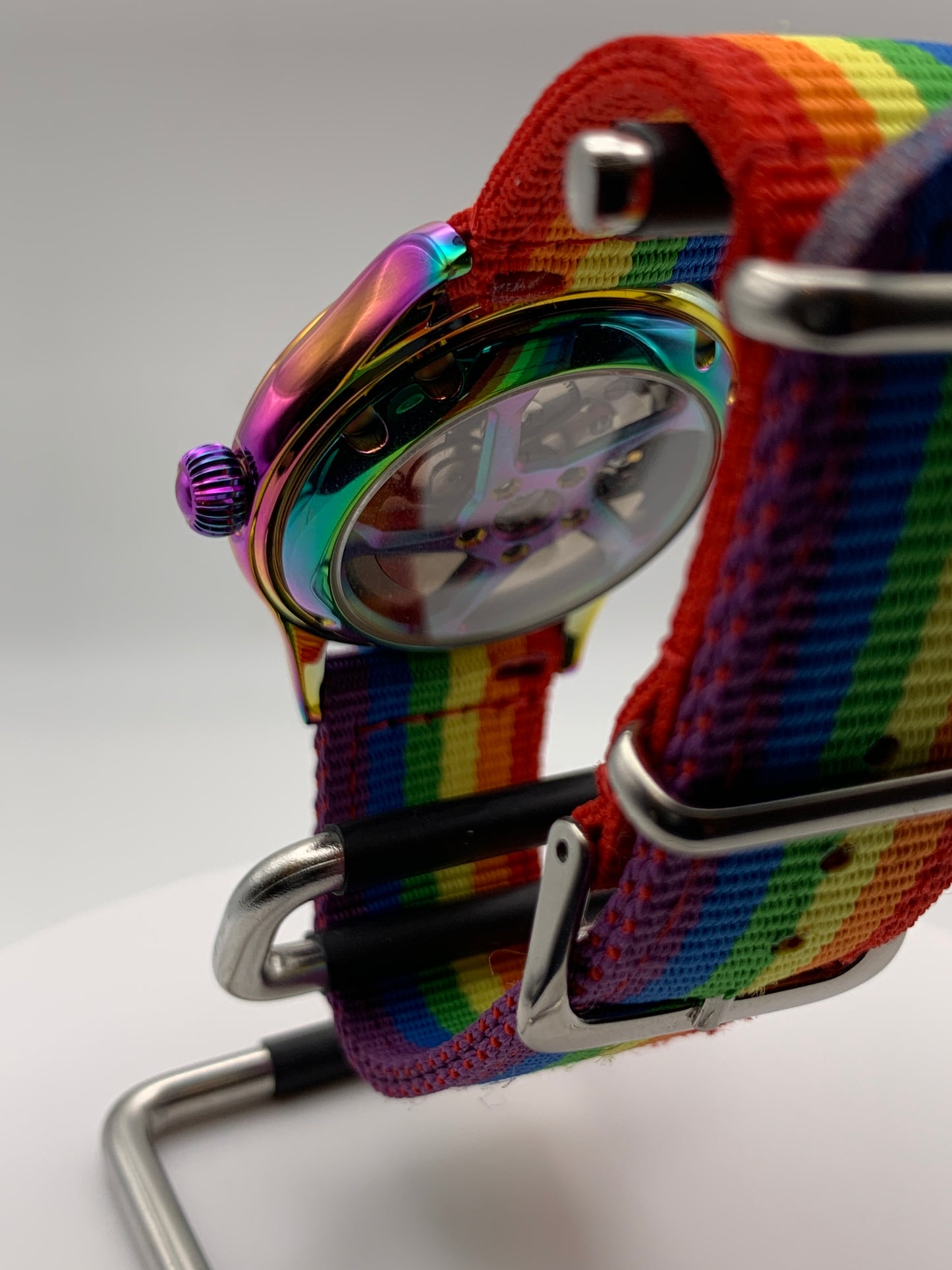 Portable rainbow. 38mm thermally colored stainless steel case and case back. Double dome K-1 mineral crystal. Seiko NH35.