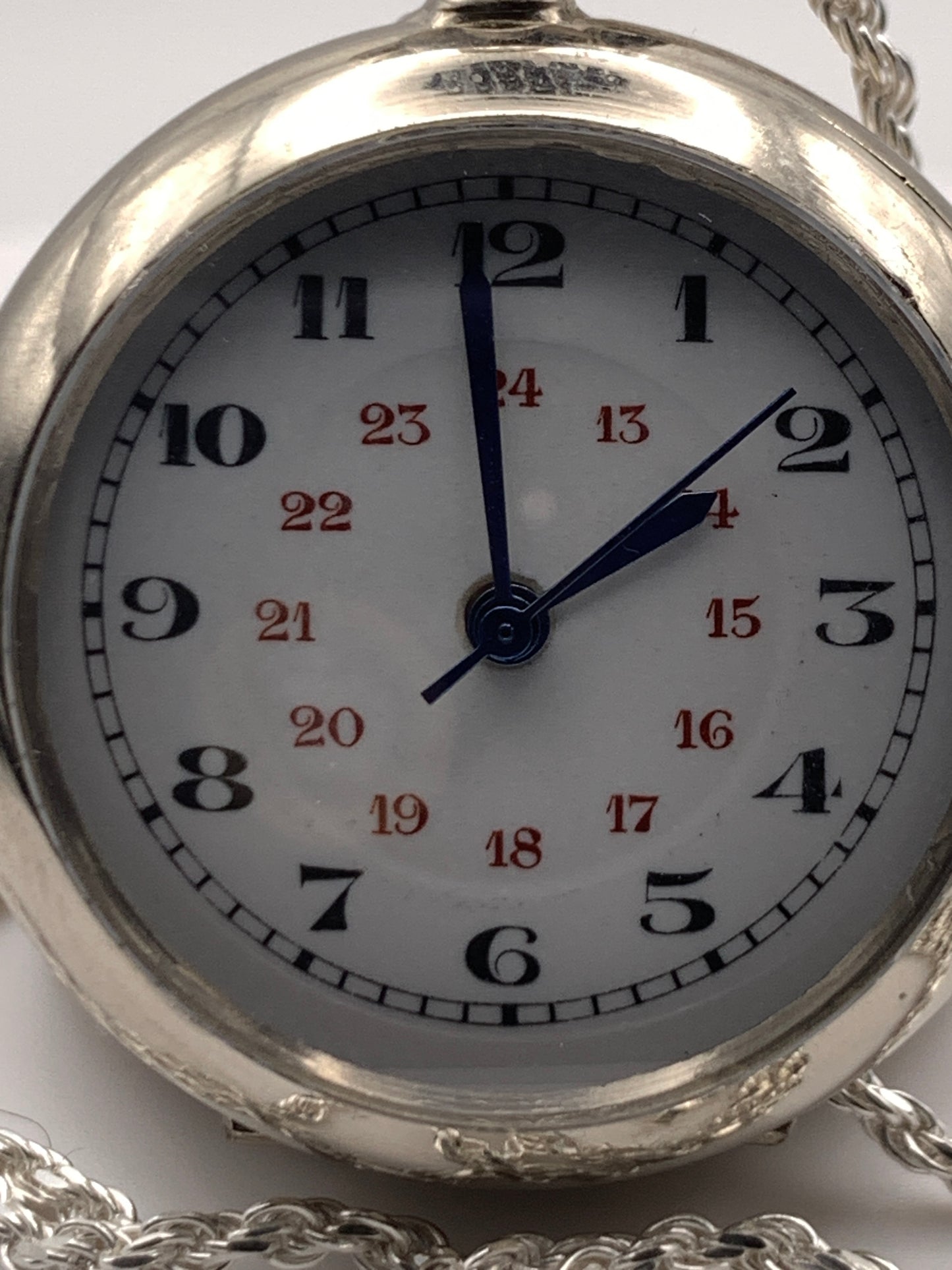 Amuse-bouche Deux. 30mm NOS Argentan alloy pocket / necklace watch. On a 24” 1.5mm sterling silver chain. Sapphire crystal. Vintage hand painted enamel dial. Miyota 2036.