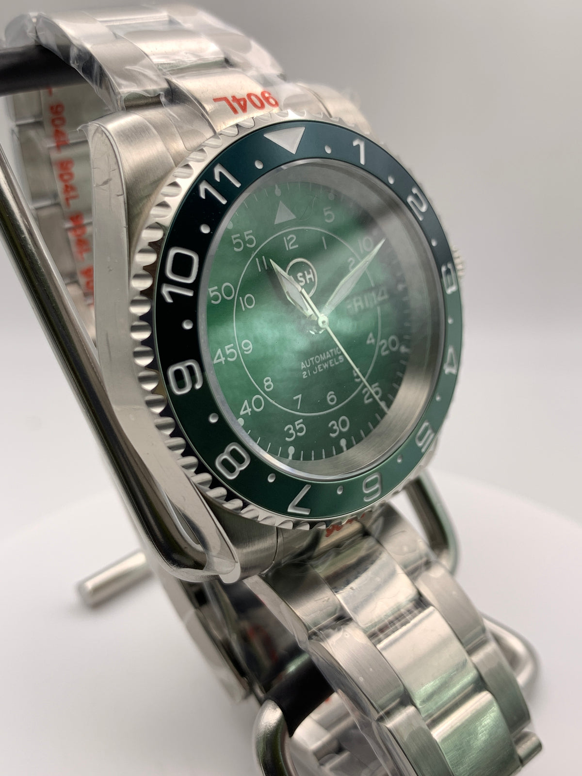 Dead Reckoning - 41mm Stainless Steel case with matching bracelet. Sapphire crystal. Seiko NH36 with green day/date wheels.