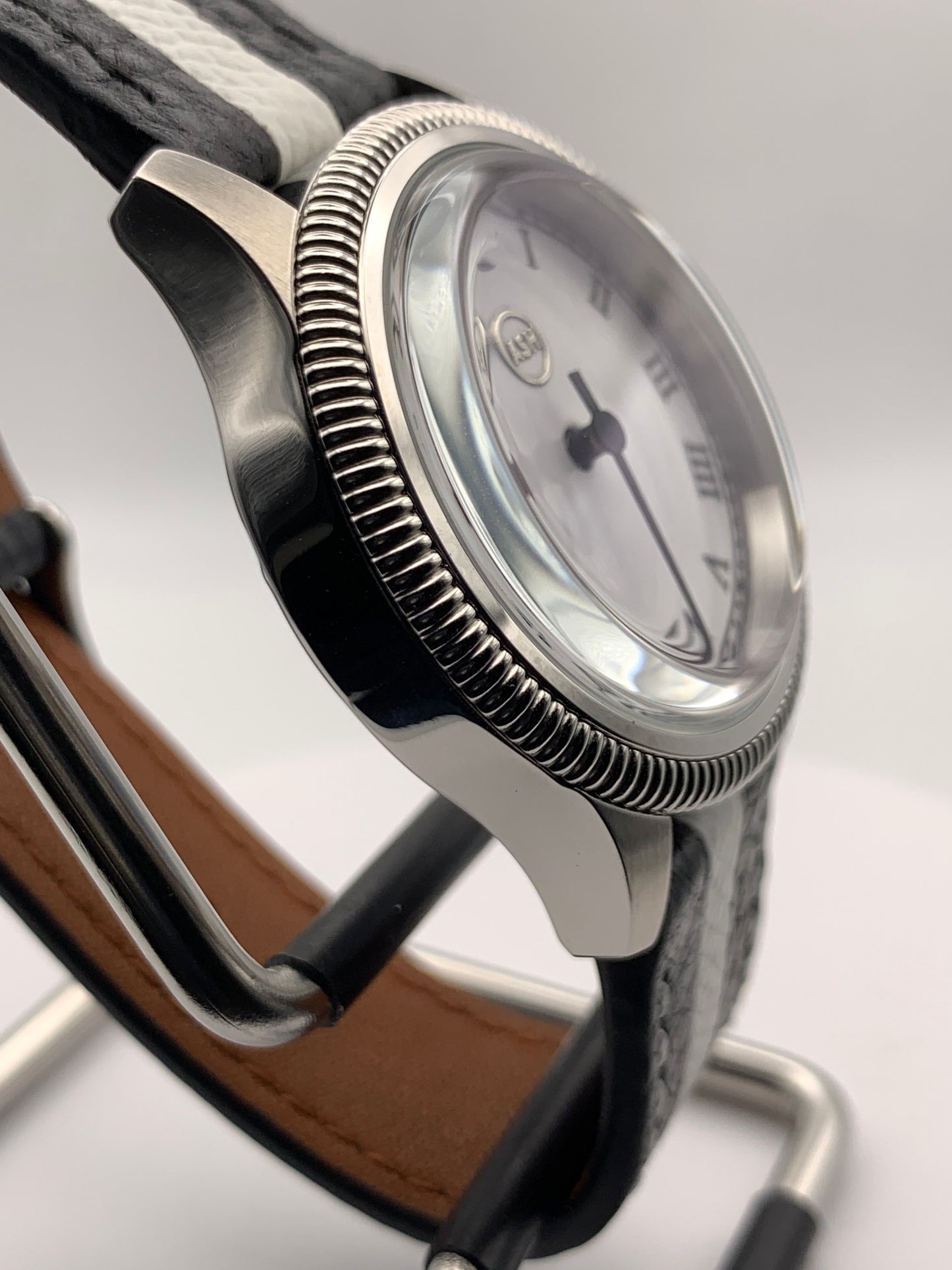 Thereabouts - One hand watch. 38mm coin edged stainless steel case. Enamel dial. Boxed K-1 crystal. Exhibition case back with blue custom rotor. Seiko NH38.
