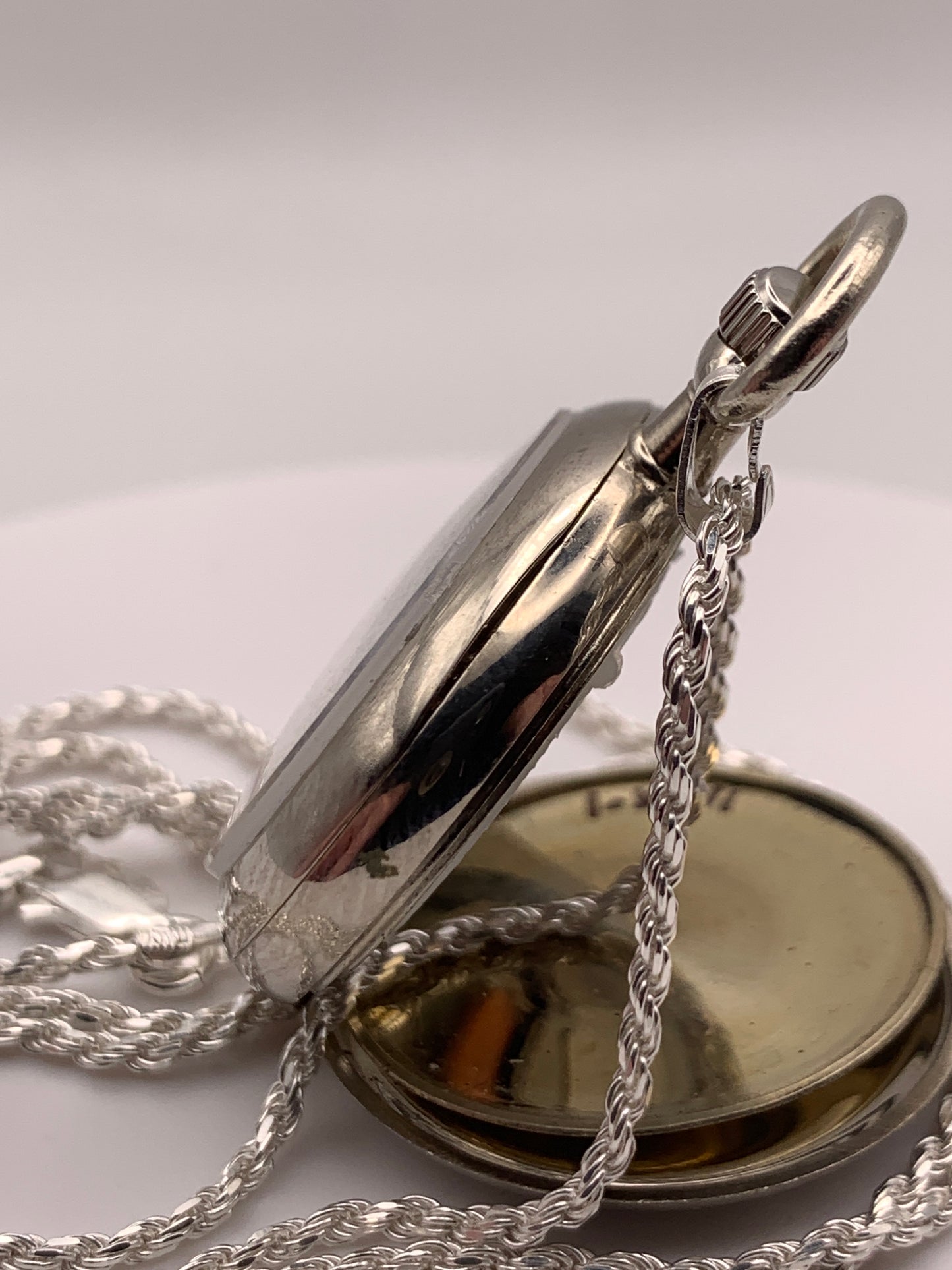 Amuse-bouche Deux. 30mm NOS Argentan alloy pocket / necklace watch. On a 24” 1.5mm sterling silver chain. Sapphire crystal. Vintage hand painted enamel dial. Miyota 2036.