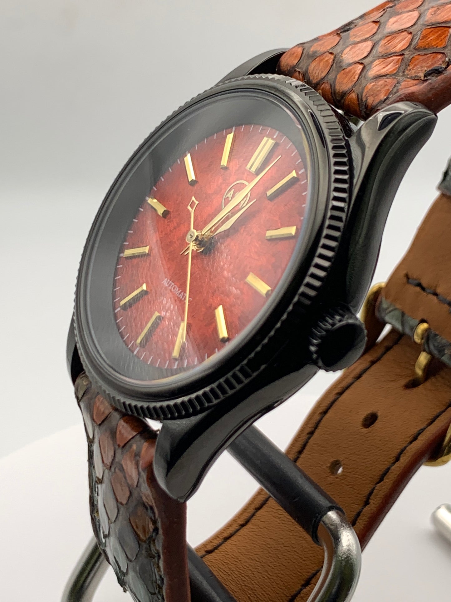 Ecthelion. Golden fire livery. 39mm fluted, PVD coated, stainless steel case. Sapphire crystal. Seiko NH38. Dragon scale strap. Mystical powers.