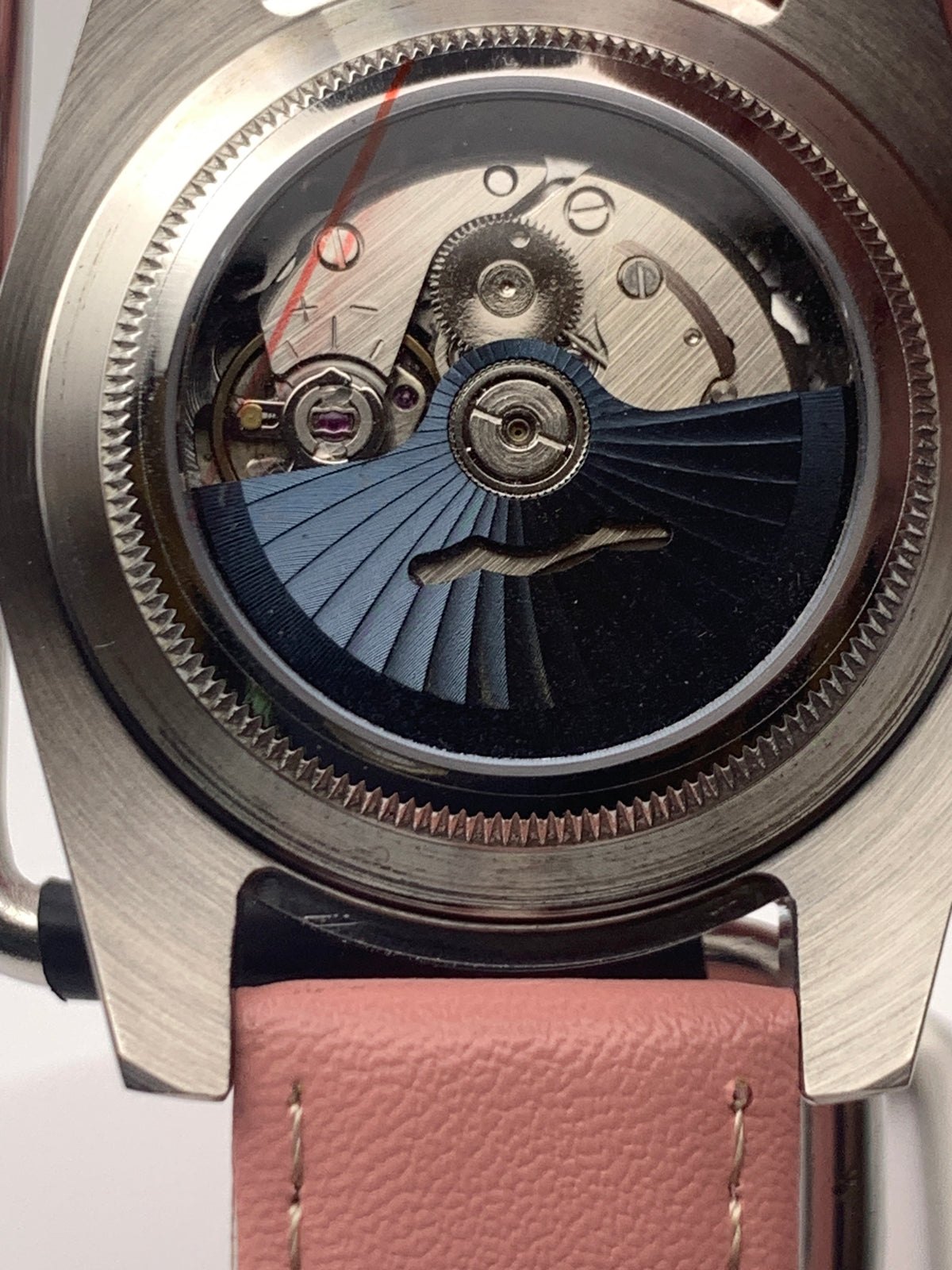Versailles 1.2 - 39mm Stainless steel case with red gasket. Sapphire crystal. Exhibition case back. Seiko NH38 with blue rotor.