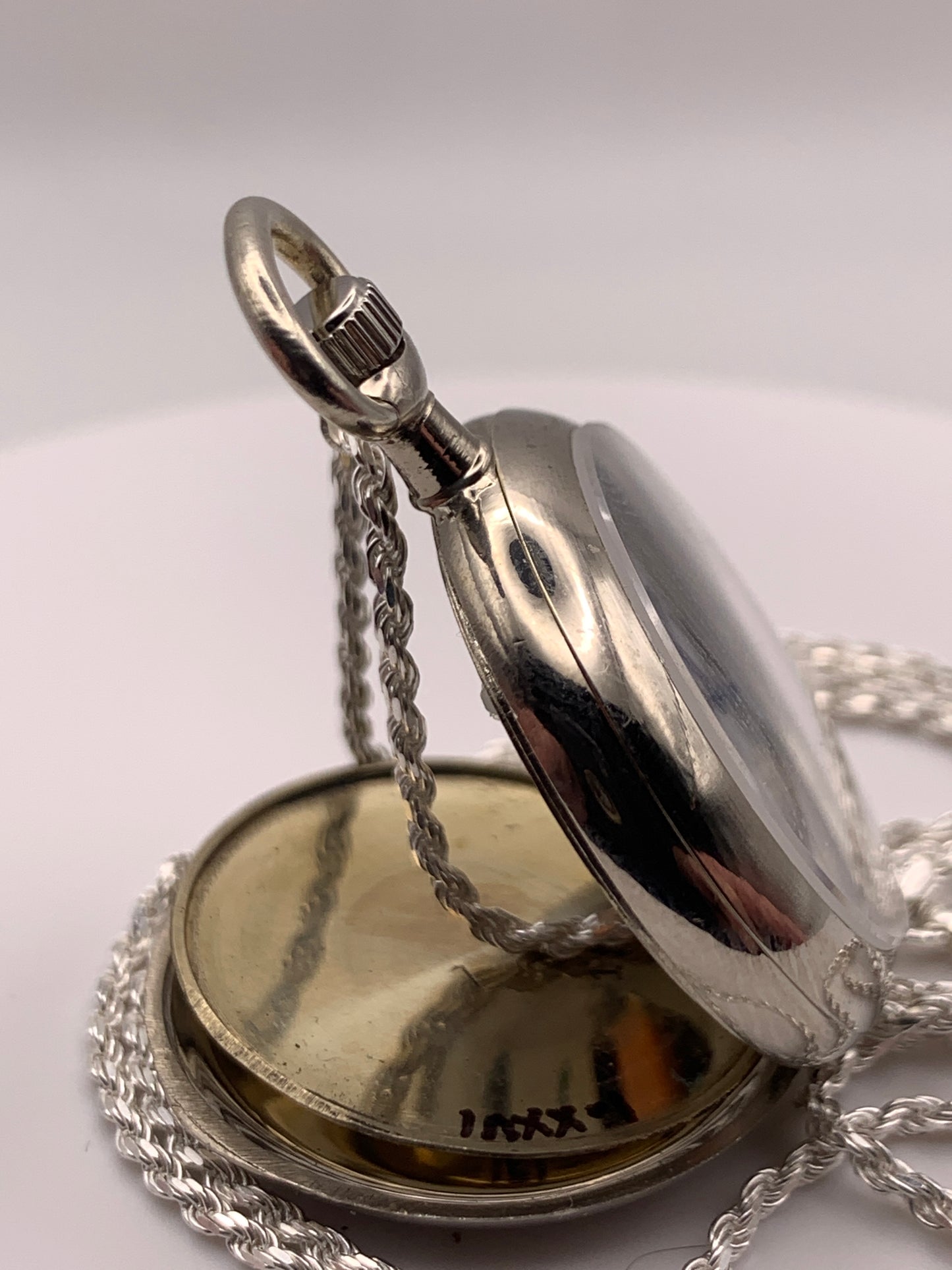 Amuse-bouche Deux. 30mm NOS Argentan alloy pocket / necklace watch. On a 24” 1.5mm sterling silver chain. Sapphire crystal. Vintage hand painted enamel dial. Miyota 2036.