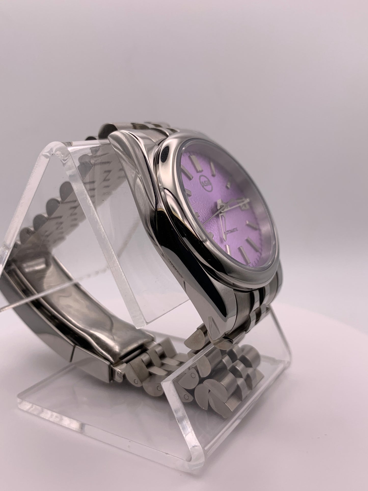 ‘Sold - Highly figured lavender dial. 36mm sport watch on bracelet.