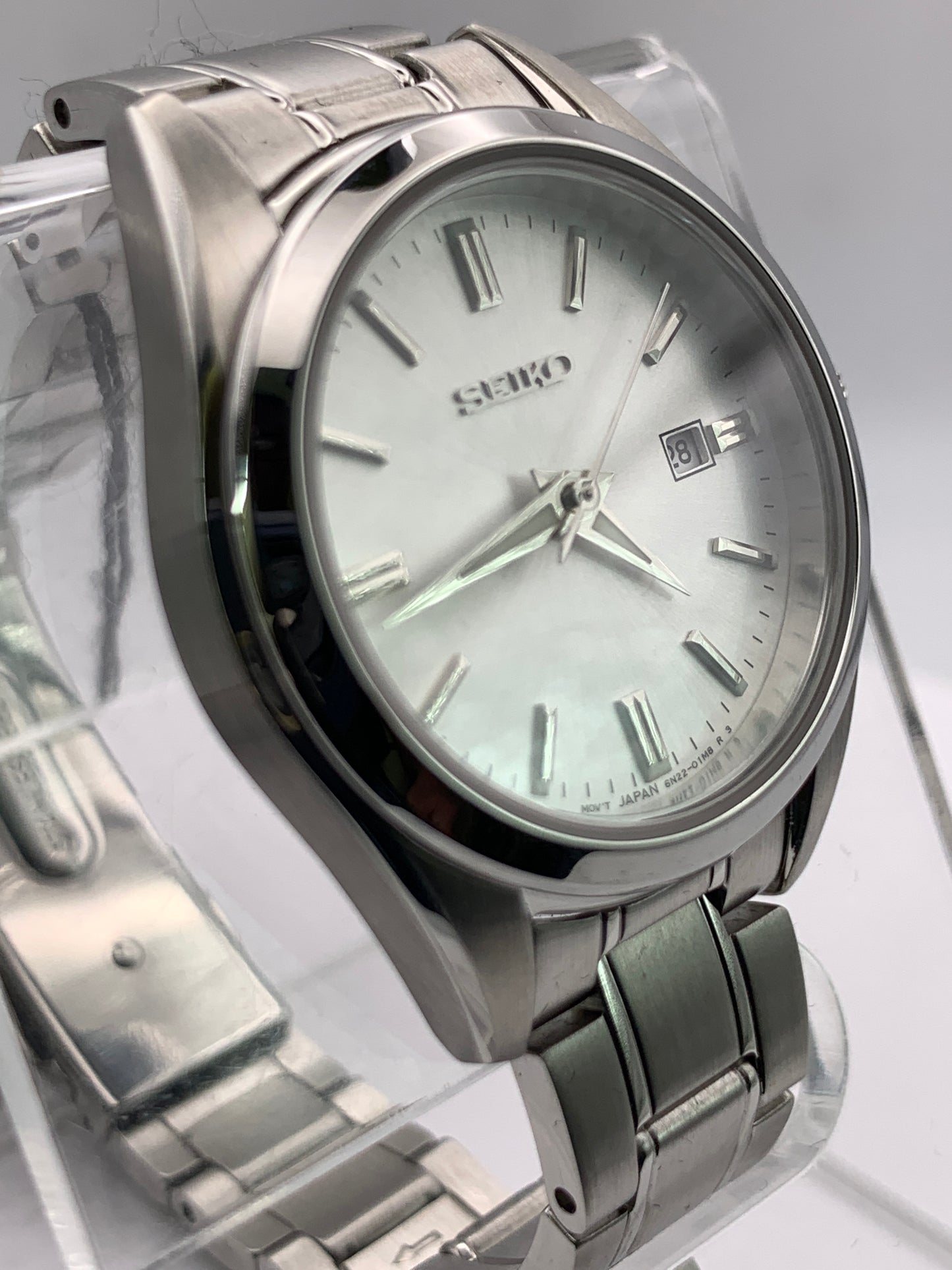 Seiko SUR633- 30mm Stainless steel case. Silver sunray dial. Sapphire crystal. 6n22 quartz movement. 100m water resistance. Box and papers.