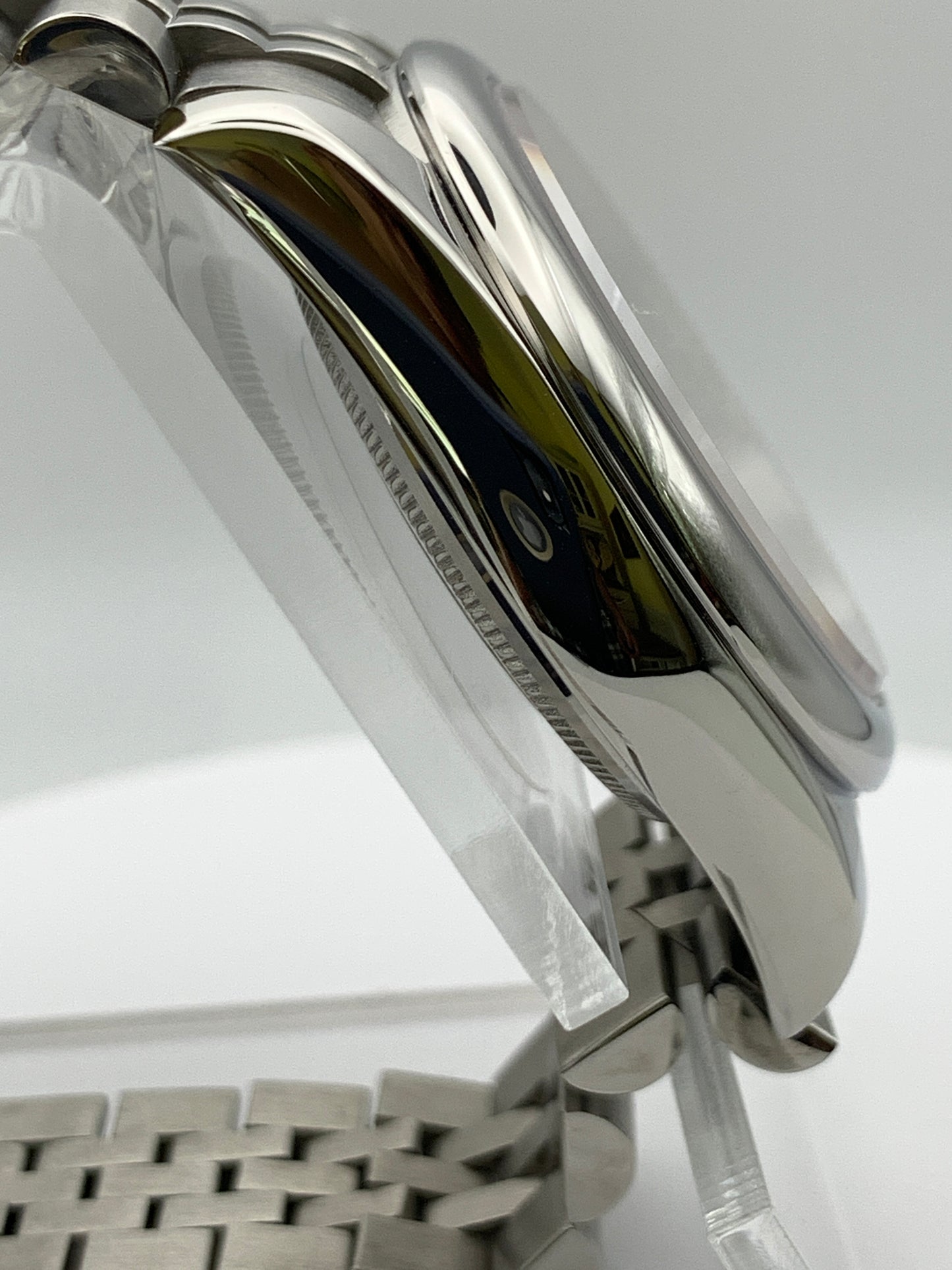 Pale yellow 36mm sport watch on bracelet.