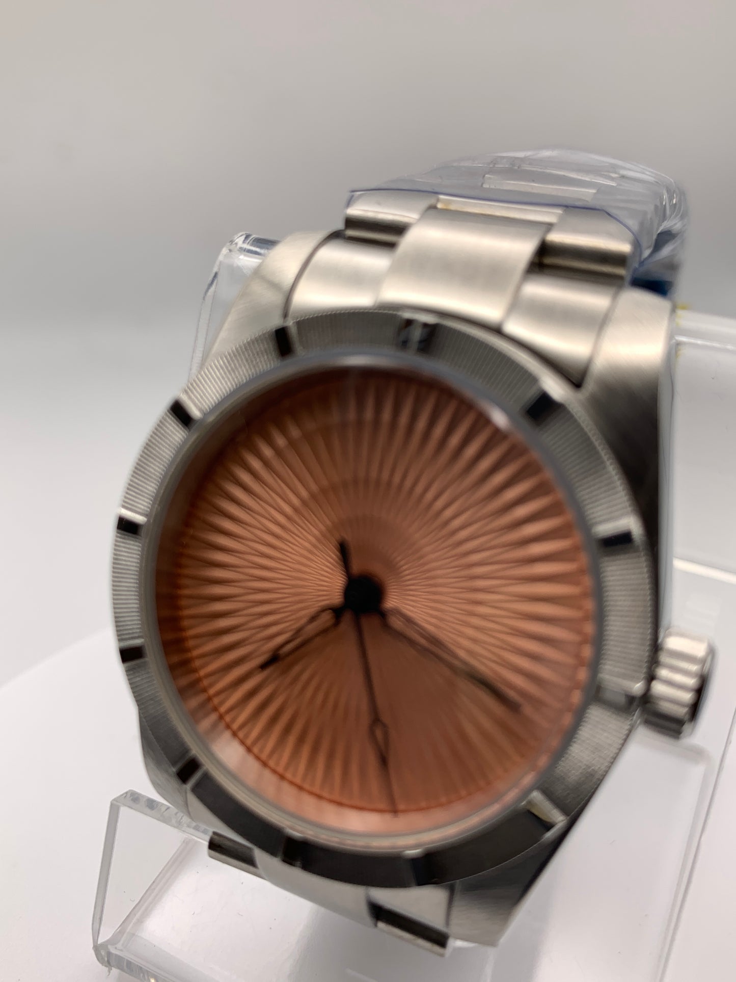 Sunbeam. 39mm stainless steel case and matching bracelet. Textured dial and unique handset. Sapphire crystal. NH38 automatic movement.