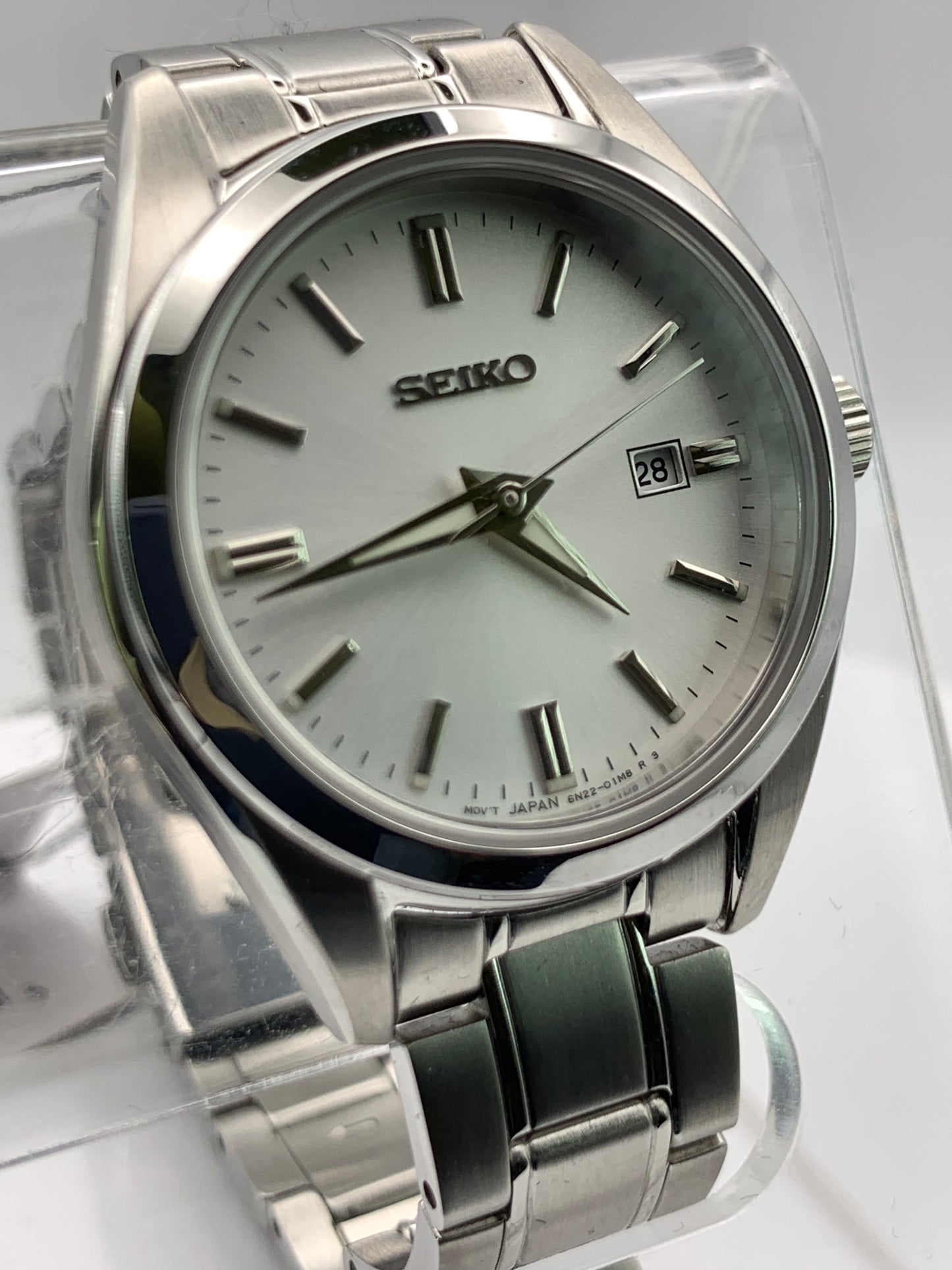 Seiko SUR633- 30mm Stainless steel case. Silver sunray dial. Sapphire crystal. 6n22 quartz movement. 100m water resistance. Box and papers.