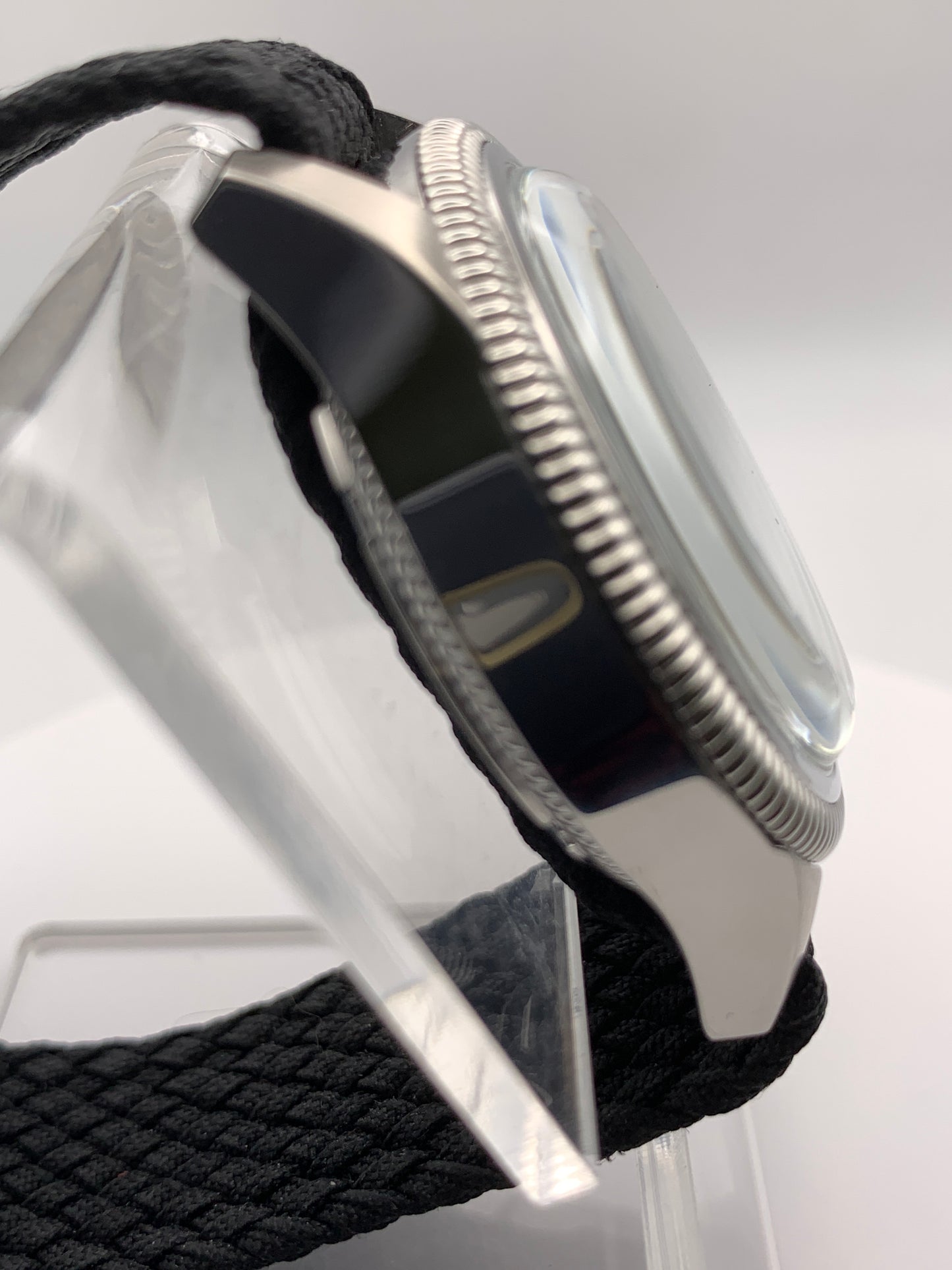 Homesick. 39mm Coin edged stainless steel case. Tobacco sunburst figured dial. AR coated domed mineral glass crystal. Seiko NH35 automatic movement.