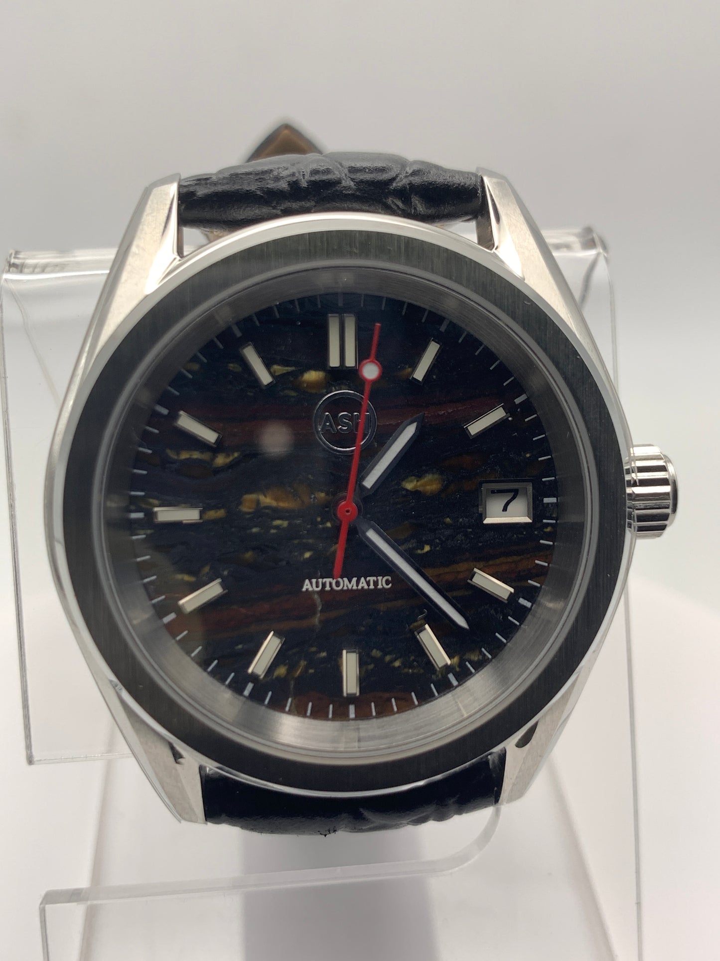 Agharta. 39mm Stainless steel. Iron Tiger Eye dial. Sapphire crystal. Seiko NH35.