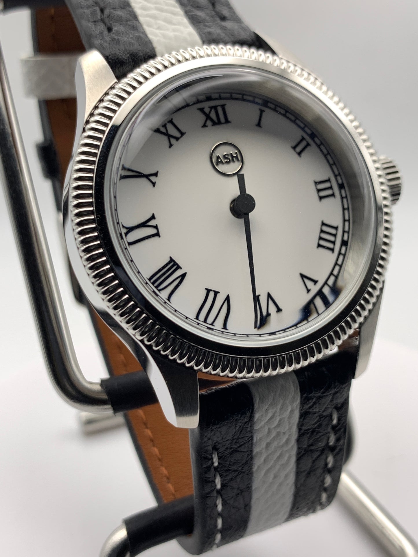 Thereabouts - One hand watch. 38mm coin edged stainless steel case. Enamel dial. Boxed K-1 crystal. Exhibition case back with blue custom rotor. Seiko NH38.