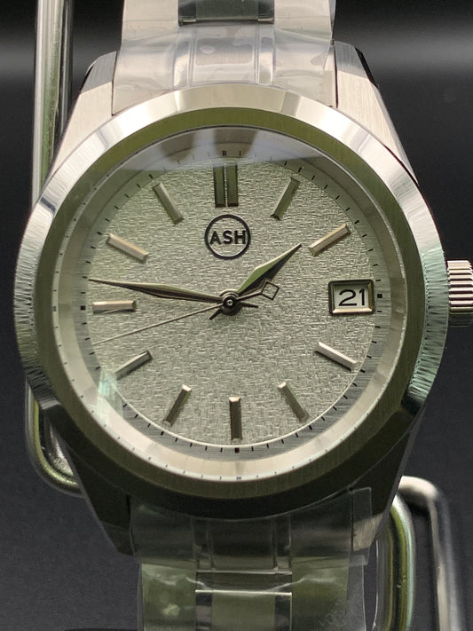 39mm Metallic shades of silver dress watch. Textured dial. Bracelet
