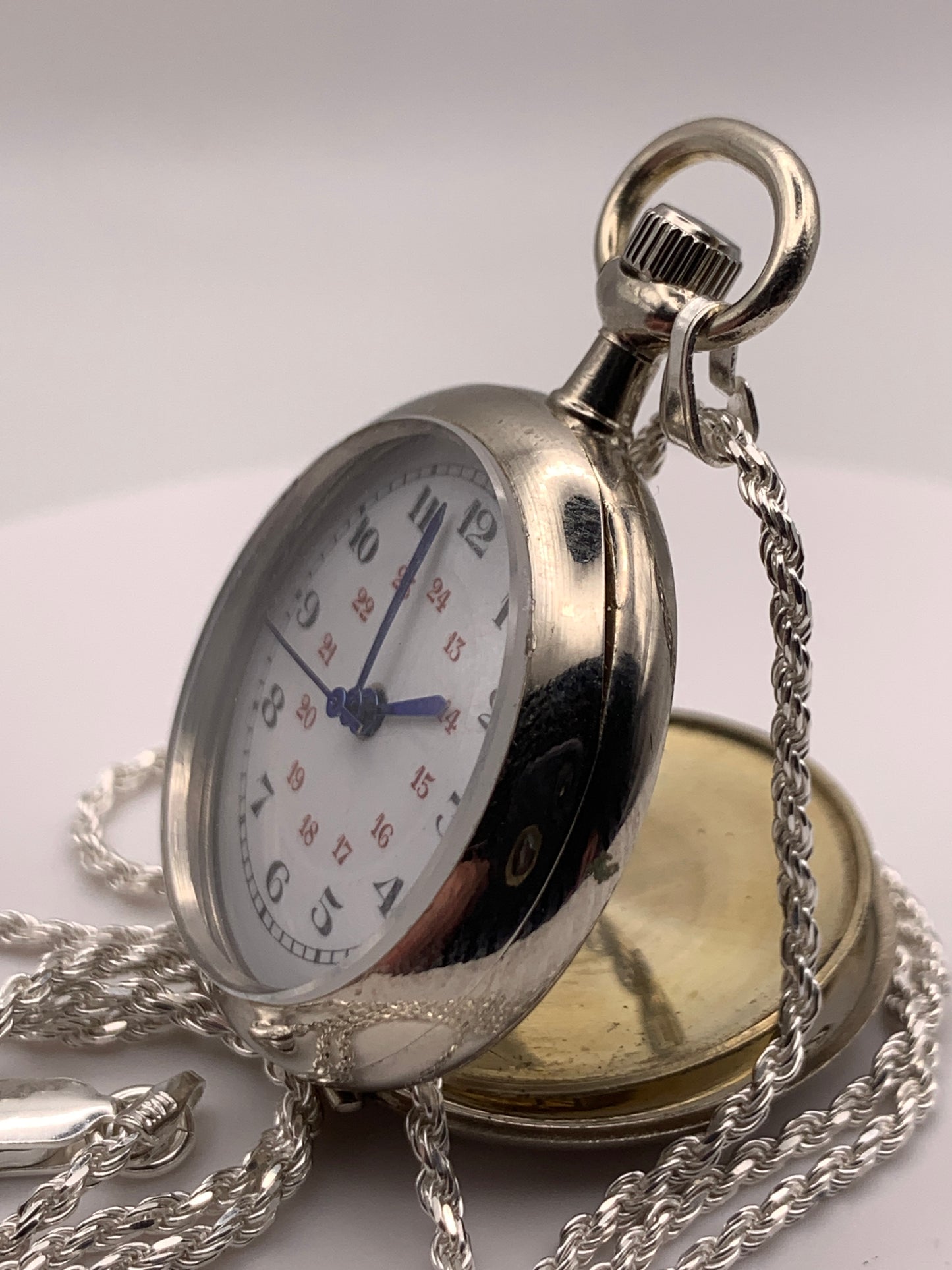 Amuse-bouche Deux. 30mm NOS Argentan alloy pocket / necklace watch. On a 24” 1.5mm sterling silver chain. Sapphire crystal. Vintage hand painted enamel dial. Miyota 2036.