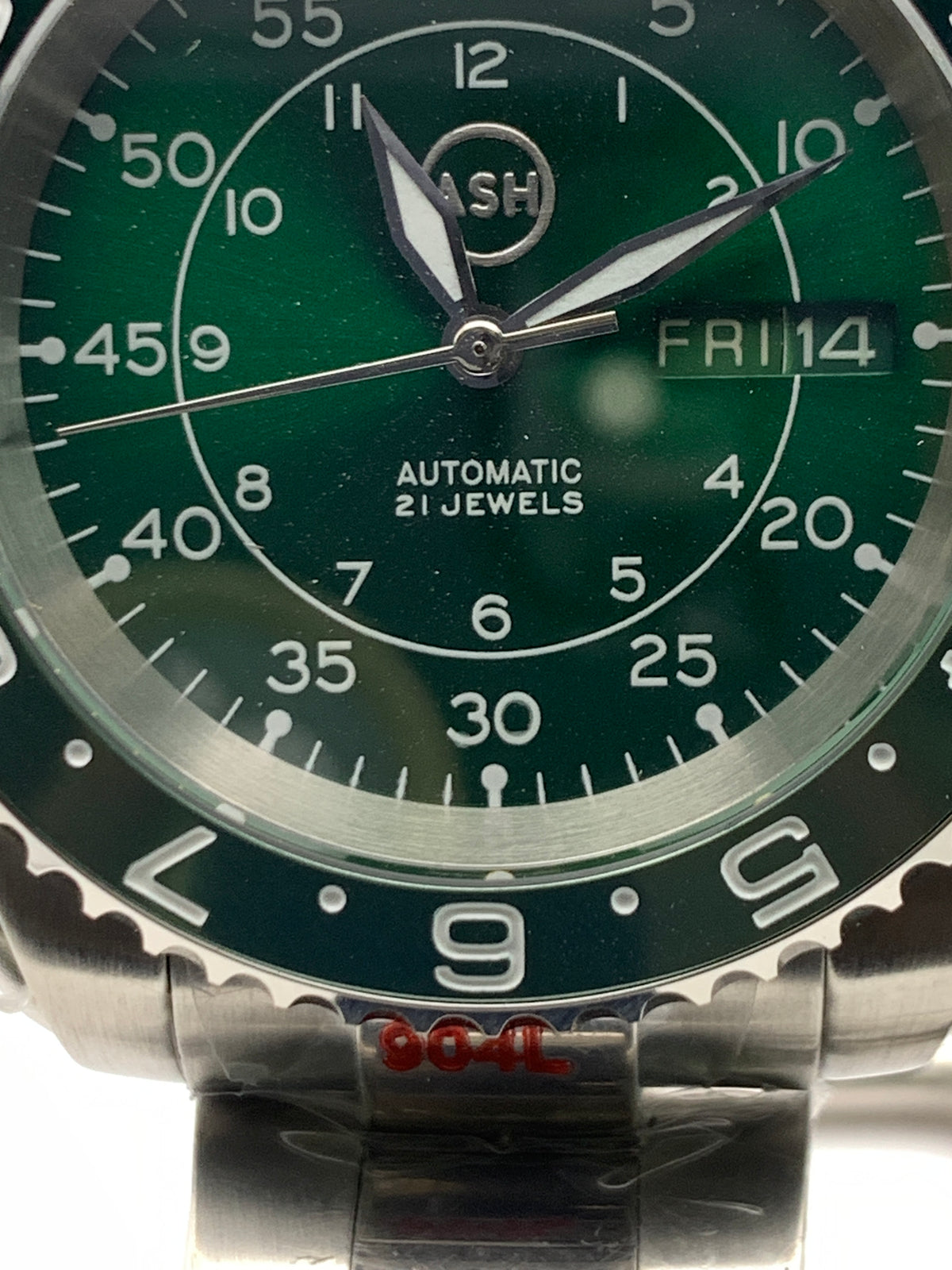 Dead Reckoning - 41mm Stainless Steel case with matching bracelet. Sapphire crystal. Seiko NH36 with green day/date wheels.