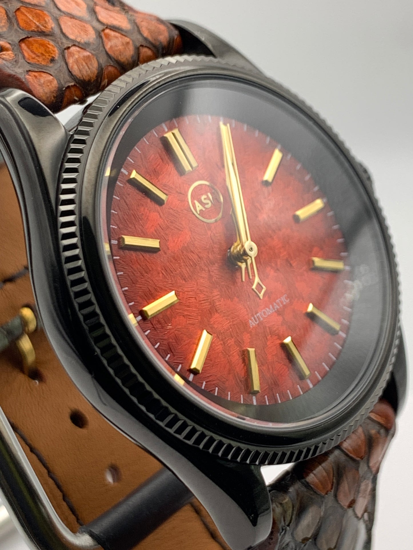 Ecthelion. Golden fire livery. 39mm fluted, PVD coated, stainless steel case. Sapphire crystal. Seiko NH38. Dragon scale strap. Mystical powers.