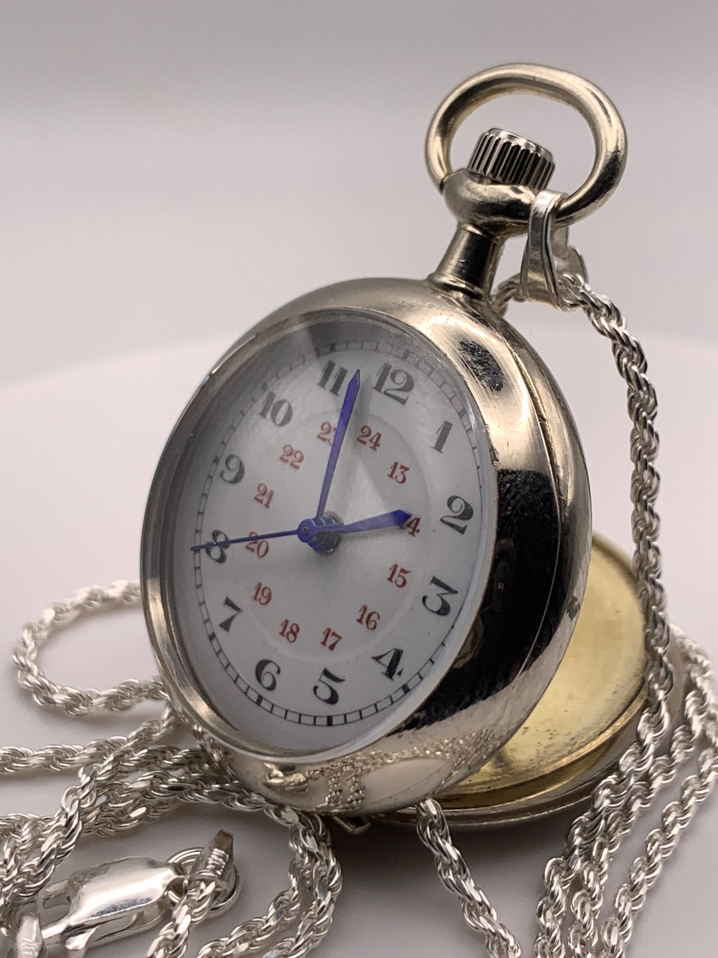 Amuse-bouche Deux. 30mm NOS Argentan alloy pocket / necklace watch. On a 24” 1.5mm sterling silver chain. Sapphire crystal. Vintage hand painted enamel dial. Miyota 2036.