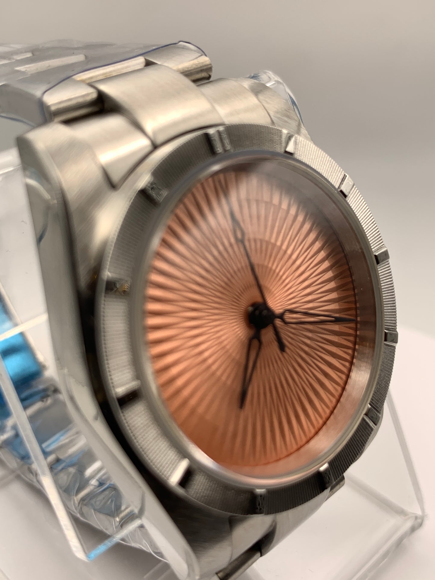 Sunbeam. 39mm stainless steel case and matching bracelet. Textured dial and unique handset. Sapphire crystal. NH38 automatic movement.
