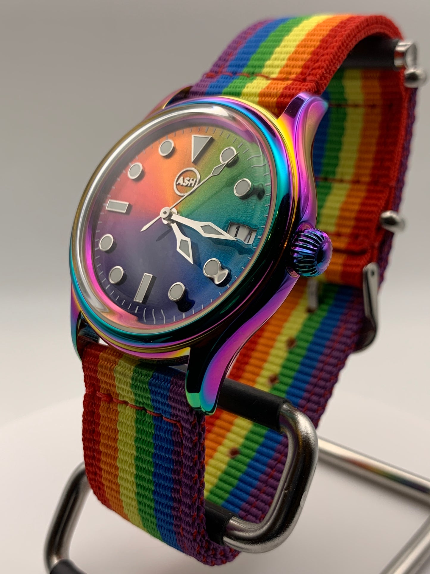 Portable rainbow. 38mm thermally colored stainless steel case and case back. Double dome K-1 mineral crystal. Seiko NH35.