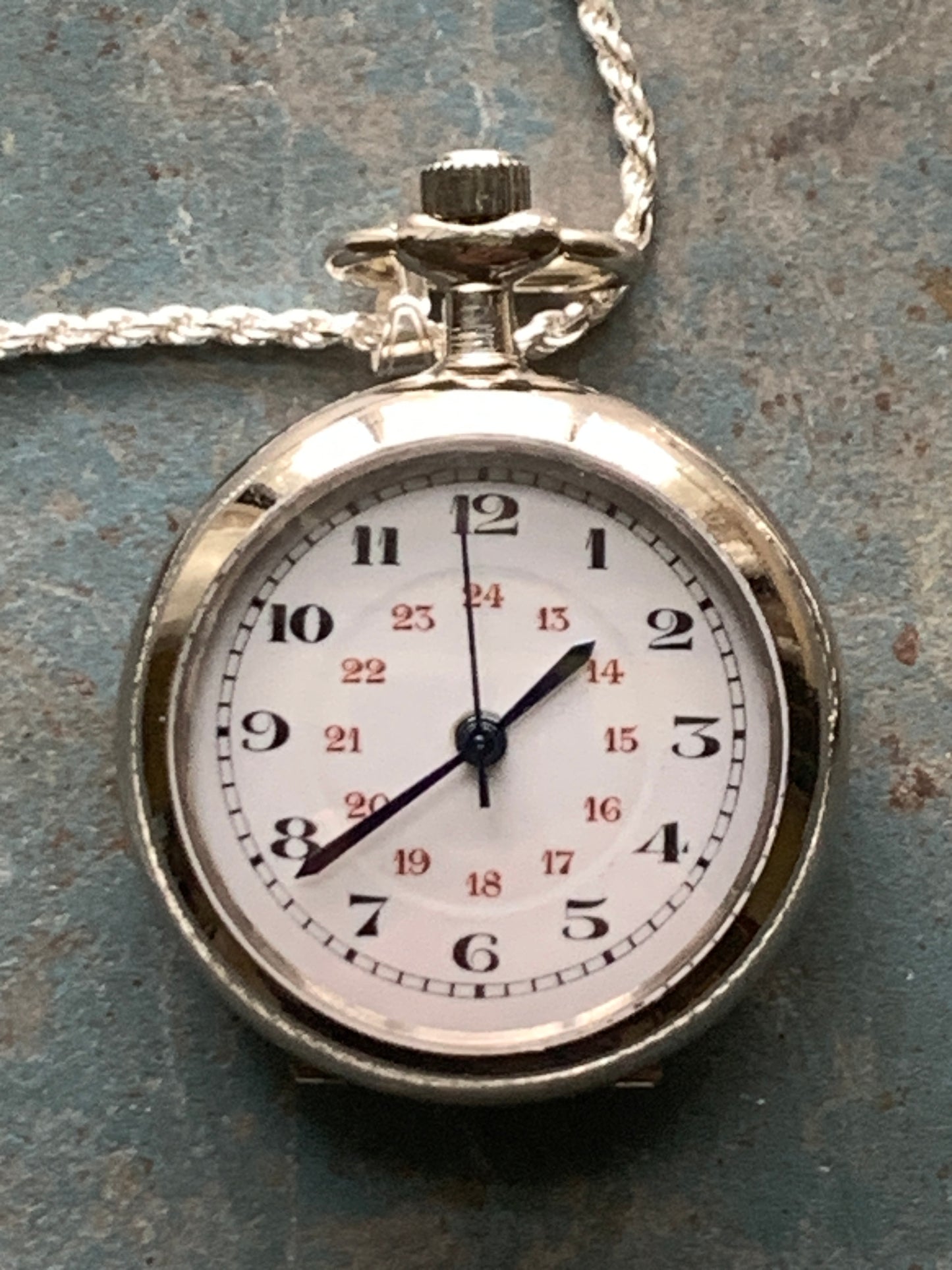 Amuse-bouche Deux. 30mm NOS Argentan alloy pocket / necklace watch. On a 24” 1.5mm sterling silver chain. Sapphire crystal. Vintage hand painted enamel dial. Miyota 2036.