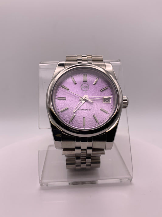 ‘Sold - Highly figured lavender dial. 36mm sport watch on bracelet.