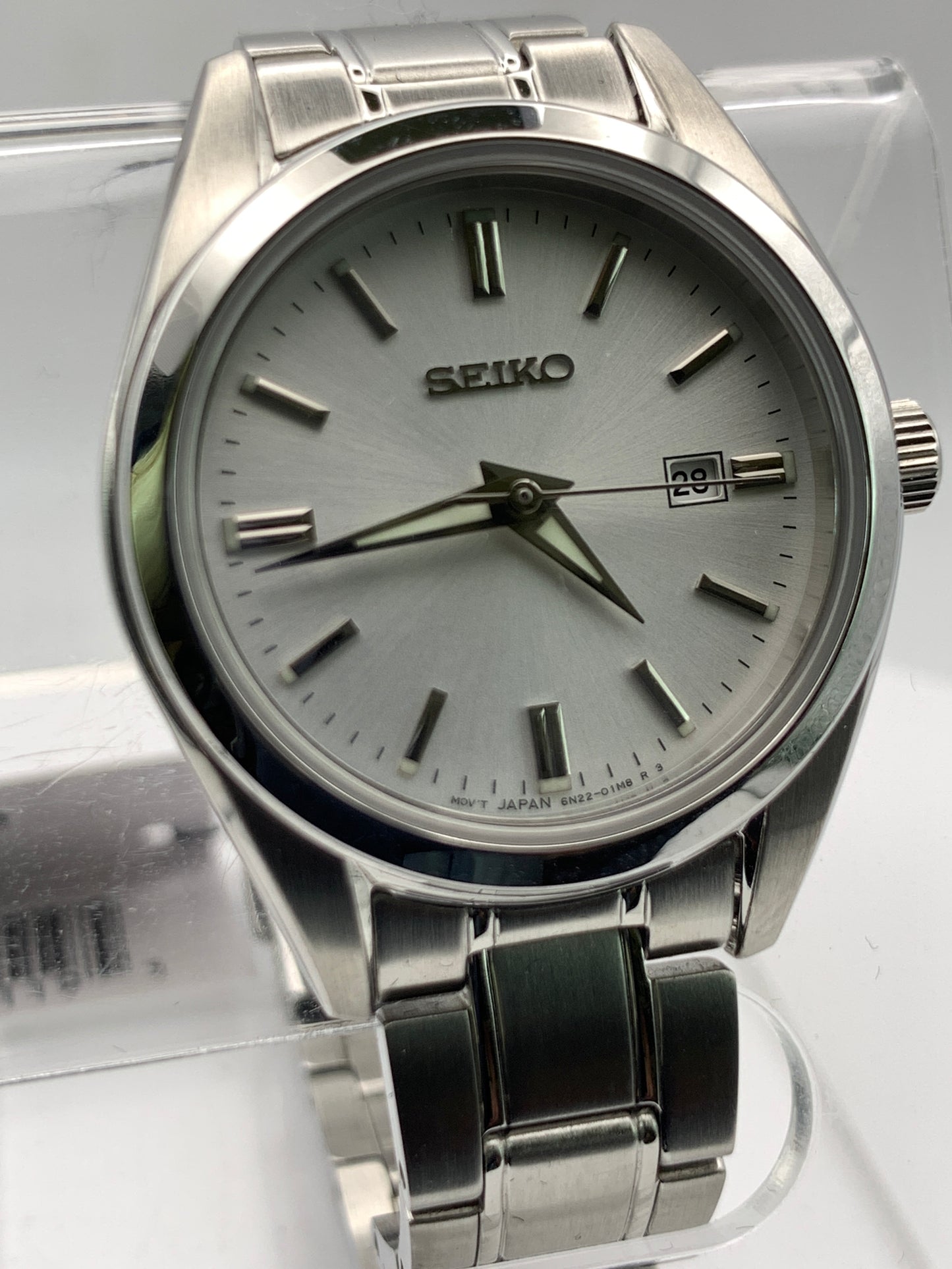 Seiko SUR633- 30mm Stainless steel case. Silver sunray dial. Sapphire crystal. 6n22 quartz movement. 100m water resistance. Box and papers.