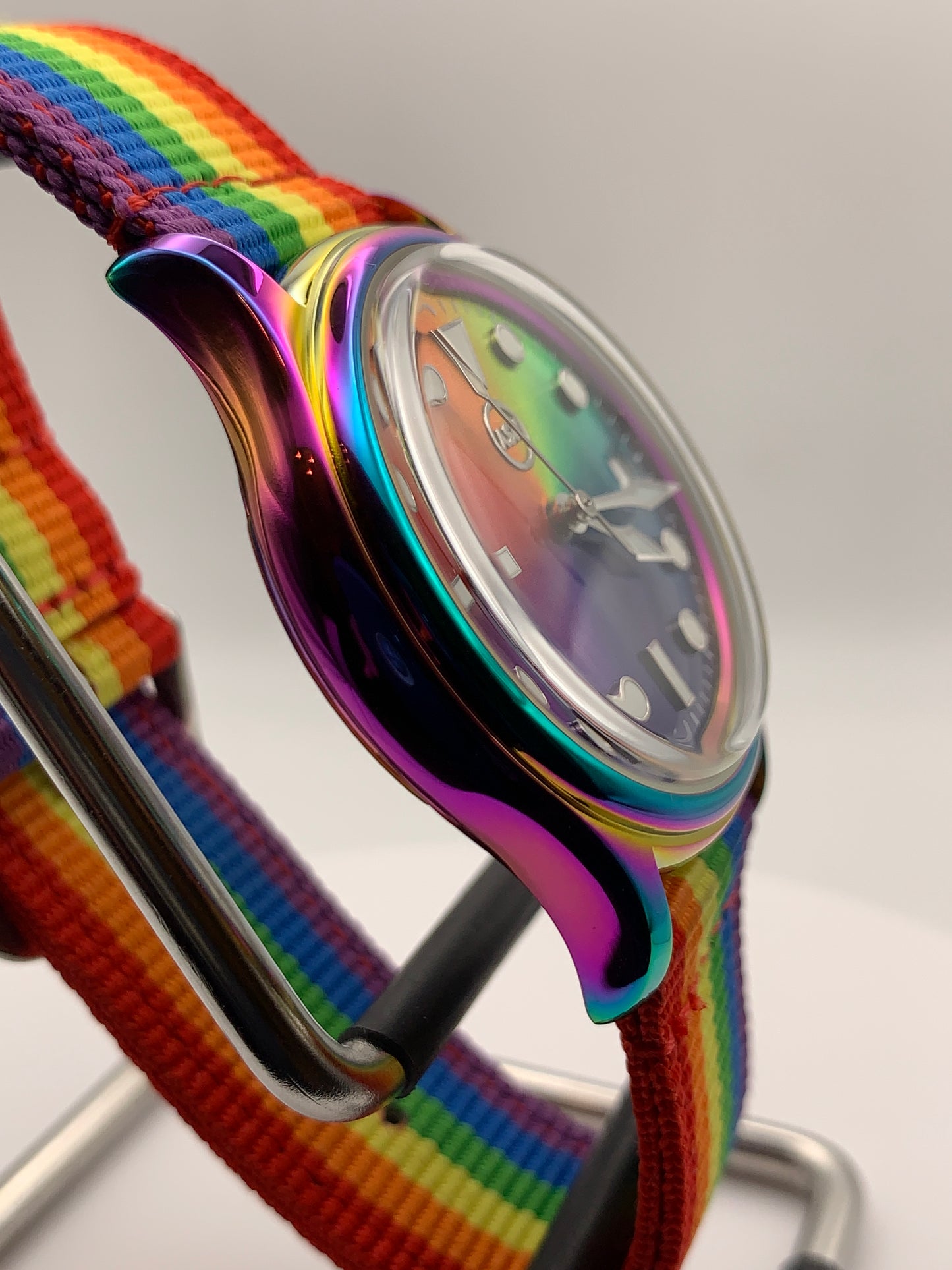 Portable rainbow. 38mm thermally colored stainless steel case and case back. Double dome K-1 mineral crystal. Seiko NH35.