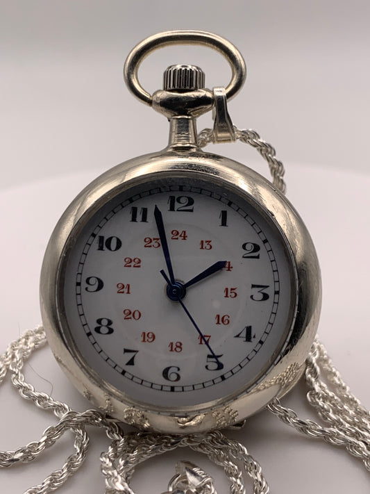 Amuse-bouche Deux. 30mm NOS Argentan alloy pocket / necklace watch. On a 24” 1.5mm sterling silver chain. Sapphire crystal. Vintage hand painted enamel dial. Miyota 2036.