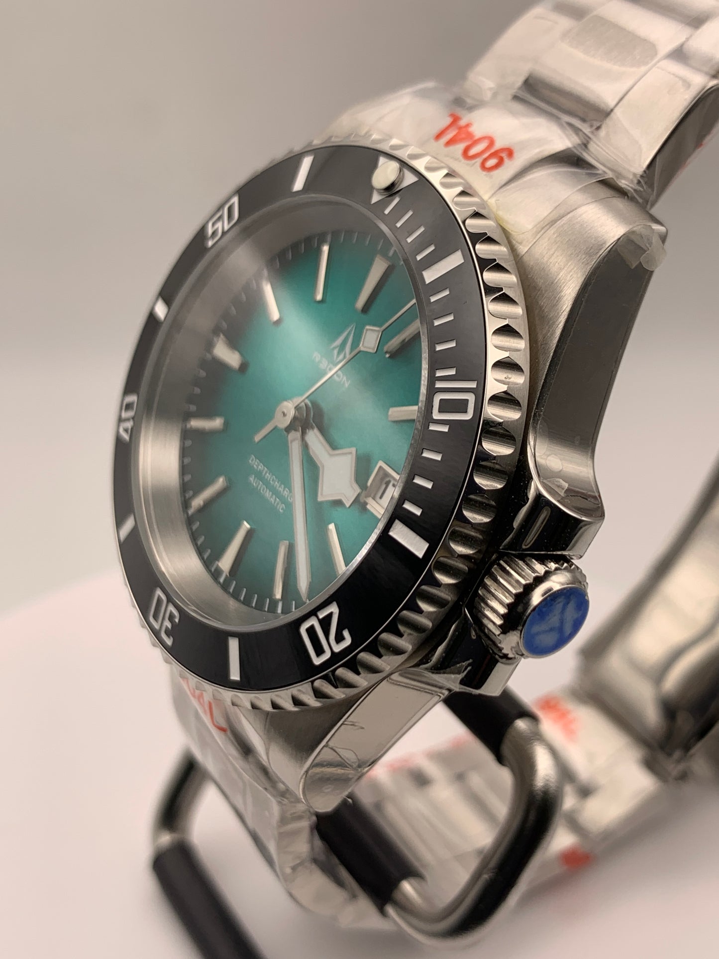 R3CON Collection. Custom teal dial watch. 40.5mm stainless steel case. Sapphire crystal. Seiko NH35.