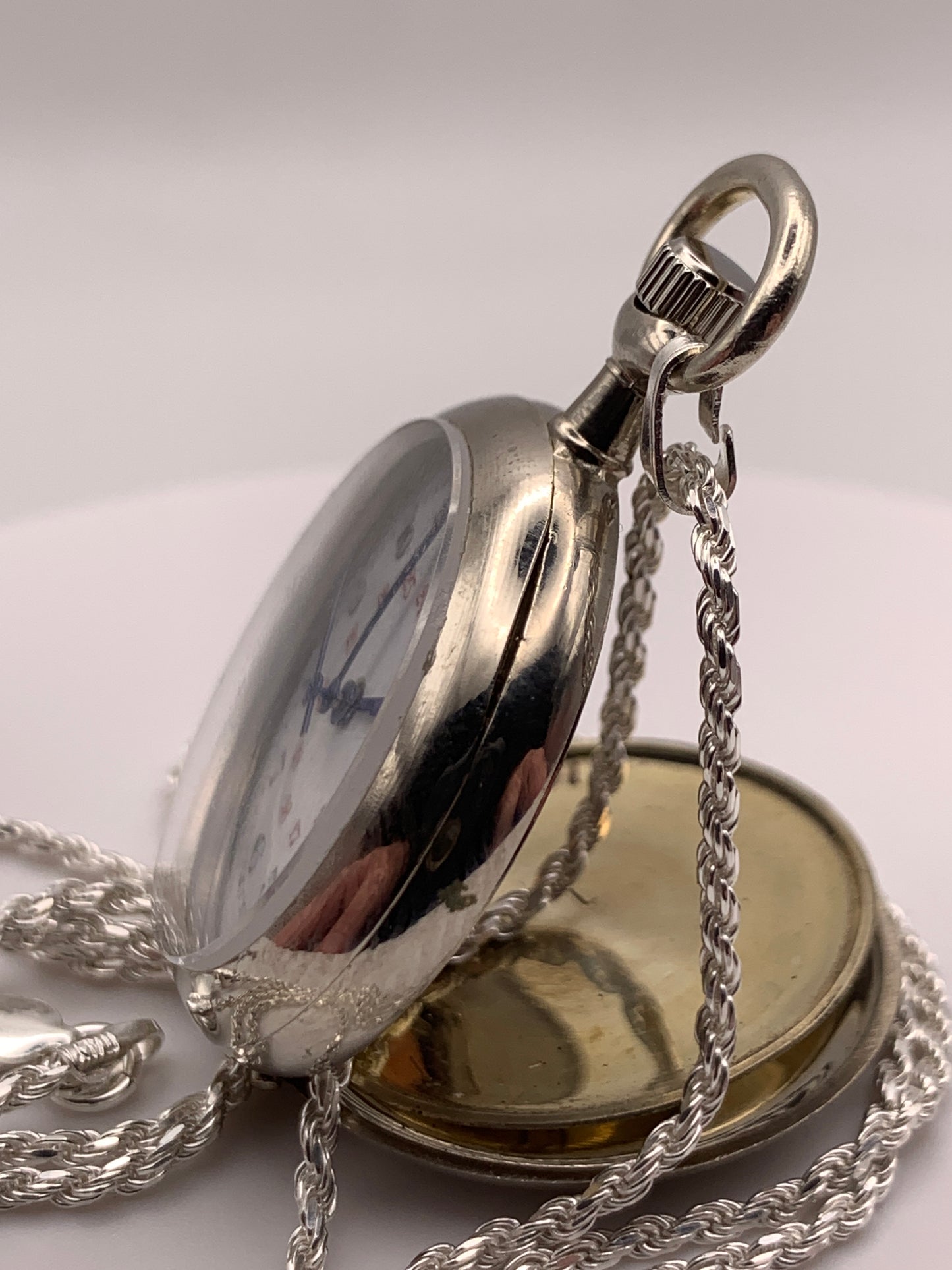 Amuse-bouche Deux. 30mm NOS Argentan alloy pocket / necklace watch. On a 24” 1.5mm sterling silver chain. Sapphire crystal. Vintage hand painted enamel dial. Miyota 2036.