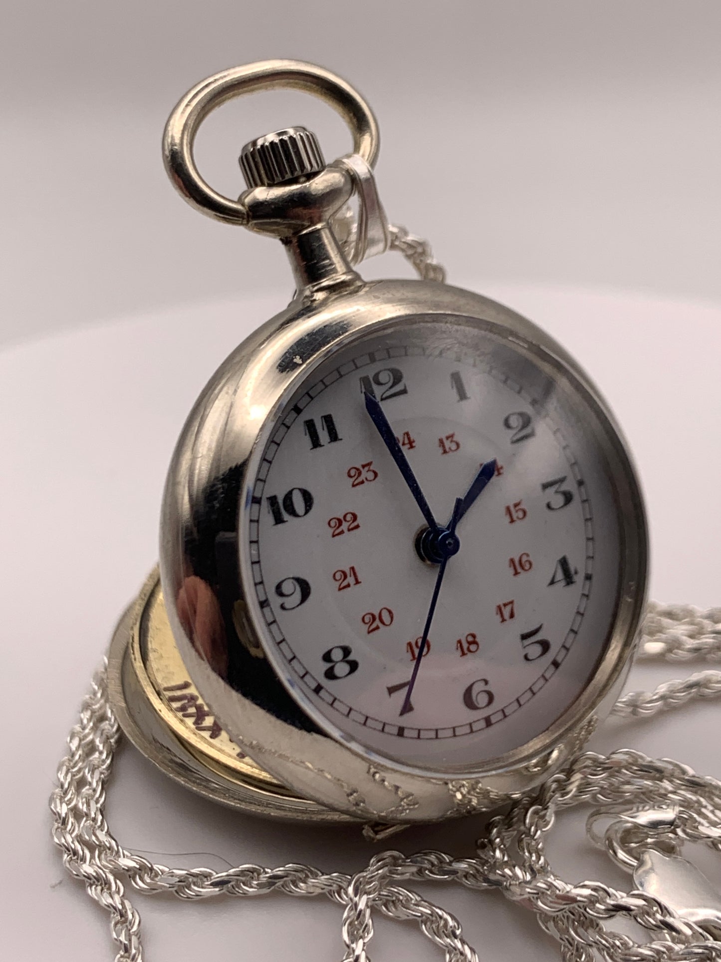 Amuse-bouche Deux. 30mm NOS Argentan alloy pocket / necklace watch. On a 24” 1.5mm sterling silver chain. Sapphire crystal. Vintage hand painted enamel dial. Miyota 2036.