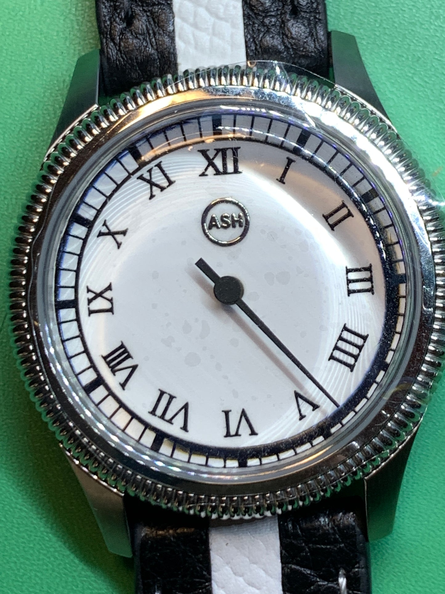 Thereabouts - One hand watch. 38mm coin edged stainless steel case. Enamel dial. Boxed K-1 crystal. Exhibition case back with blue custom rotor. Seiko NH38.
