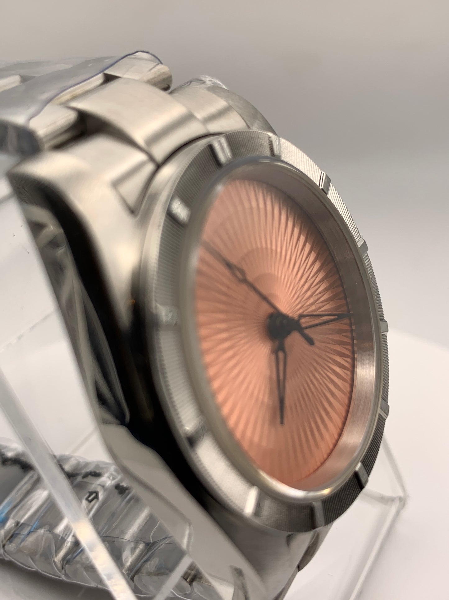 Sunbeam. 39mm stainless steel case and matching bracelet. Textured dial and unique handset. Sapphire crystal. NH38 automatic movement.