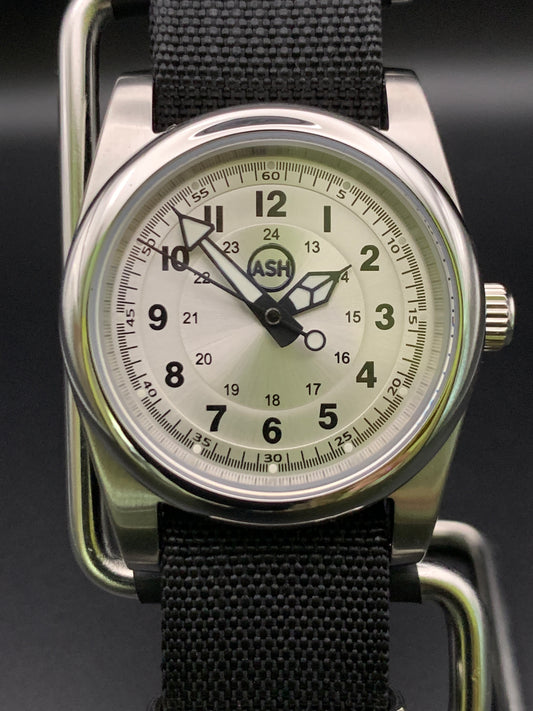 Silver sunray and black field watch. 36mm. Sapphire crystal. Seiko NH38.